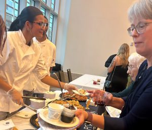 Students serve bread