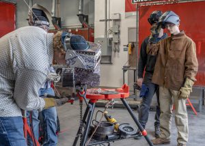 Erica Miller/ Capital Region BOCES Photographer 
Devlin Schewe, junior from Niskayuna in Welding I, watches Shaden Marable and Chloe Armstrong, combo welders, demonstrate during Careers in Construction Month event at Capital Region BOCES on Wednesday, October 8, 2025.