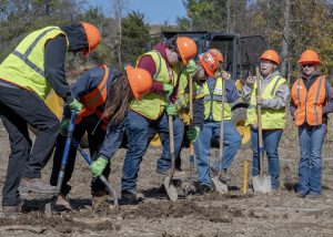 Students use shovels