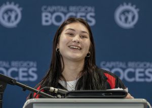 Emma smiles on podium
