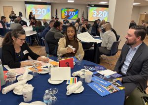 People talk around a table