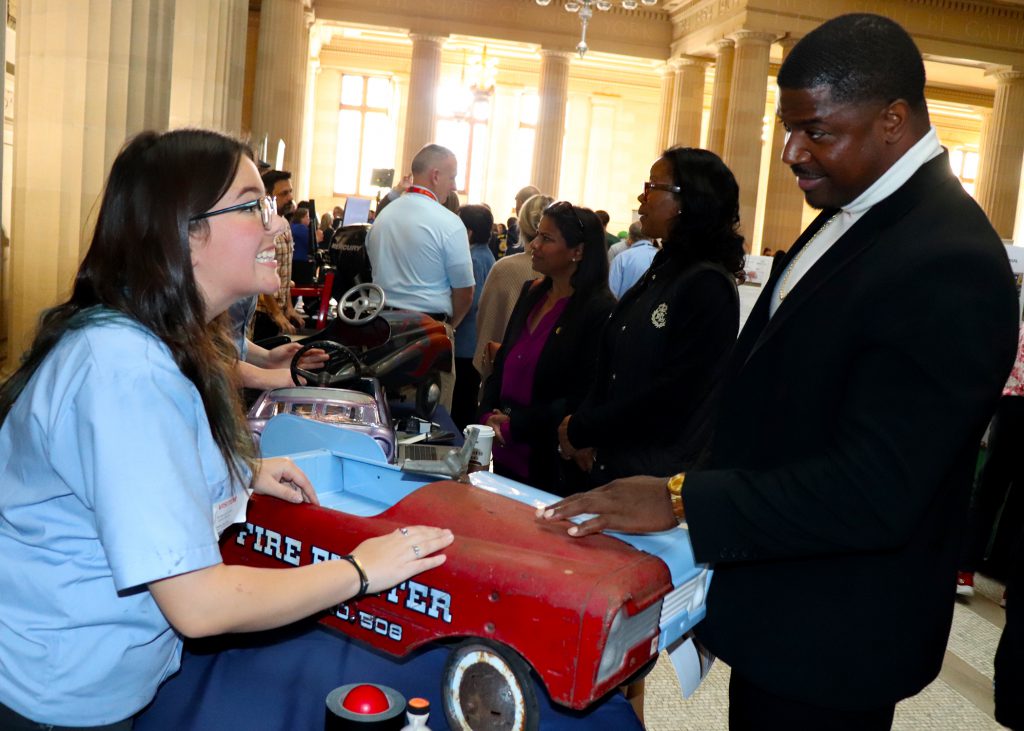 Student talks to a guest