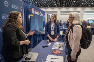 Three people speak at the vendor showcase
