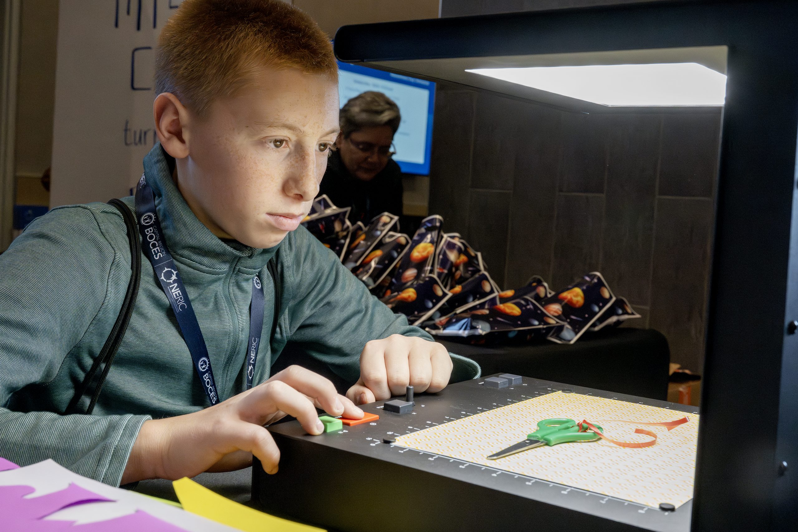 A student is concentrating at a desk