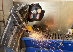 students makes sparks grinding