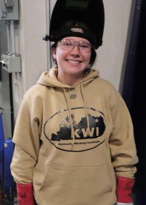 Student poses and smiles