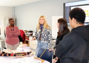 Piper talks to students and teacher Kema Maxwell