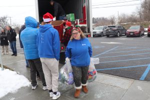 SELFI students and staff unload a massive delivery of donated Christmas Pajamas. 