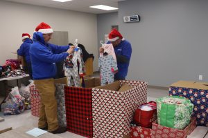SELFI students and staff launch their massive Christmas Pajamas sorting event. 