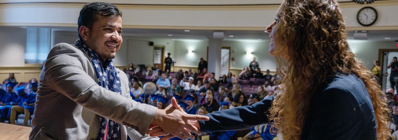 A nursing student takes the blood pressure of another student.