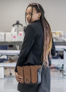 Student Dicey Lewis, senior of Cohoes, models one of her Global Fashion instructor Karen “Kema” Maxwell’s bags during class at Capital Region BOCES in Albany on Friday, February 6, 2026. Kema’s bags will be featured in New Year City Fashion Week, LA Fashion Week and Milan.