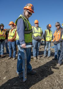 Students work with a contractior 