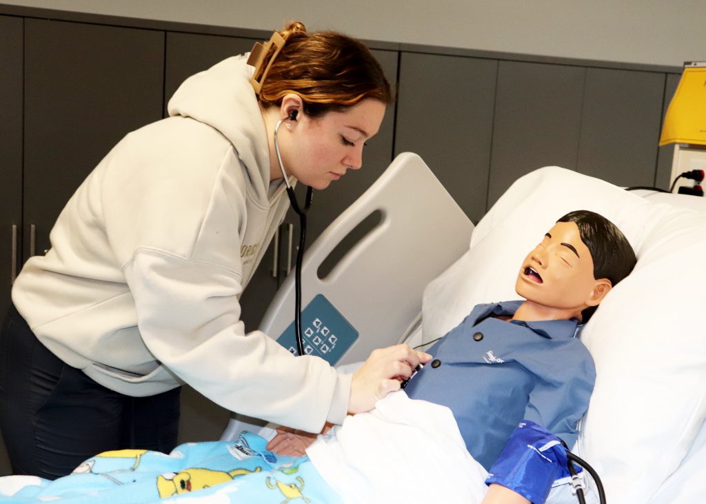 Student taking lung sounds