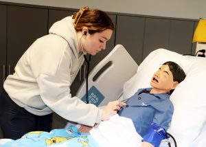 Student taking lung sounds