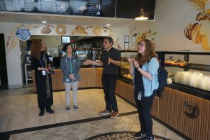 A photo of Capital Region BOCES staff and the owner of Tuscan Bakery in Menands.