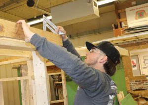 Student working on a building