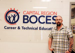 Turek poses by CRB sign