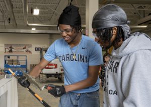 students work on masonry together