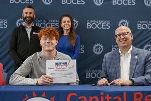 Kid signing letter
