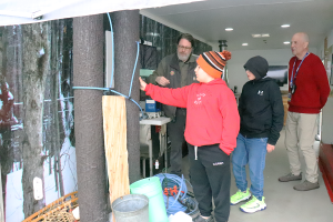 Students aboard the NY Maple Experience trailer.