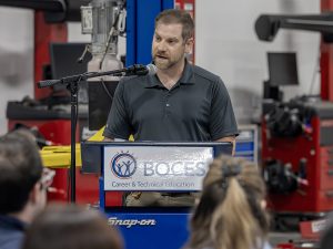 Business partner speaks at podium