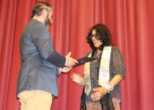 student receives his certificate