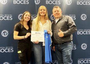 Student poses with teacher