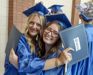 students hug