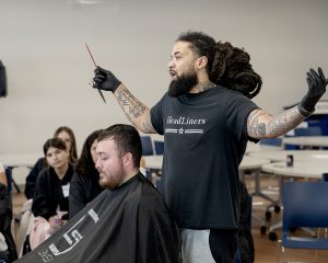 Guest speaker Aaron Brown, owner of Headliners Barber Lounge, speaks to students in the Cosmetology Summer Session at Capital Region BOCES on Wednesday, July 22, 2026.