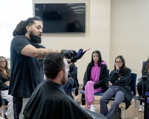 Erica Miller/ Capital Region BOCES Photographer 
Guest speaker Aaron Brown, owner of Headliners Barber Lounge, speaks to studs in the Cosmetology Summer Session at Capital Region BOCES on Wednesday, July 22, 2026.