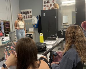 Adult speaking to students 