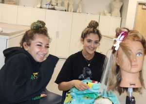 Students smile while working
