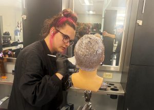 Student working on a mannaquin