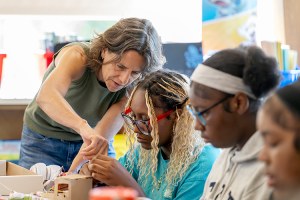 Future STEM Executive Director Terri Stripling instructs a group of young female students.