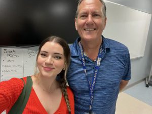 Student poses with teacher