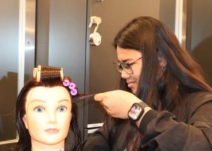 Student cuts hair