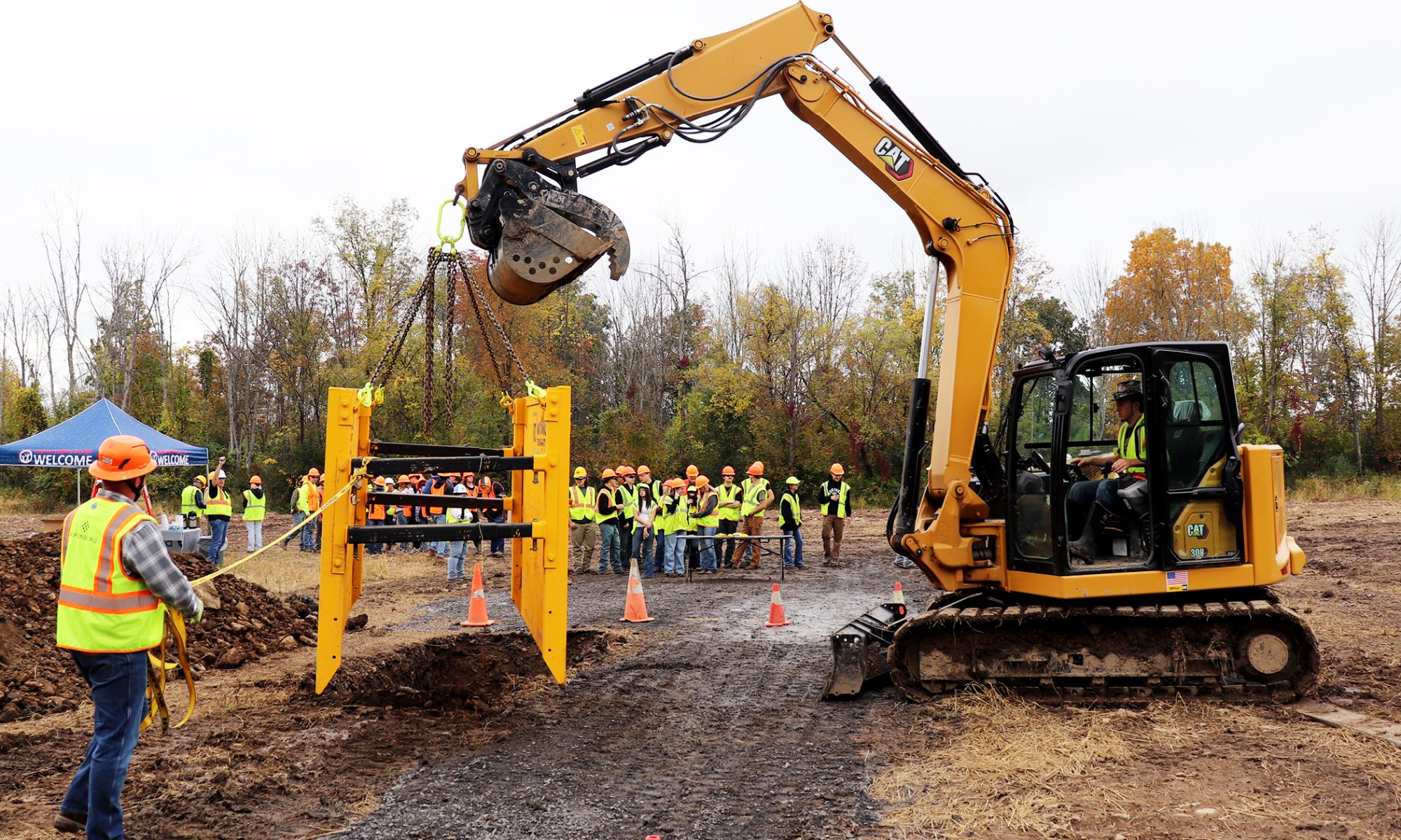 A trench box is lowered into a trench