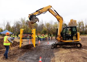 A trench box is lowered into a trench
