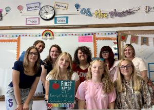 Students pose with teacher