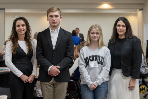 Two CRB administrators are photographed standing next to two student board of education members.