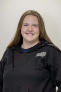 A head shot of a student wearing a black sweatshirt